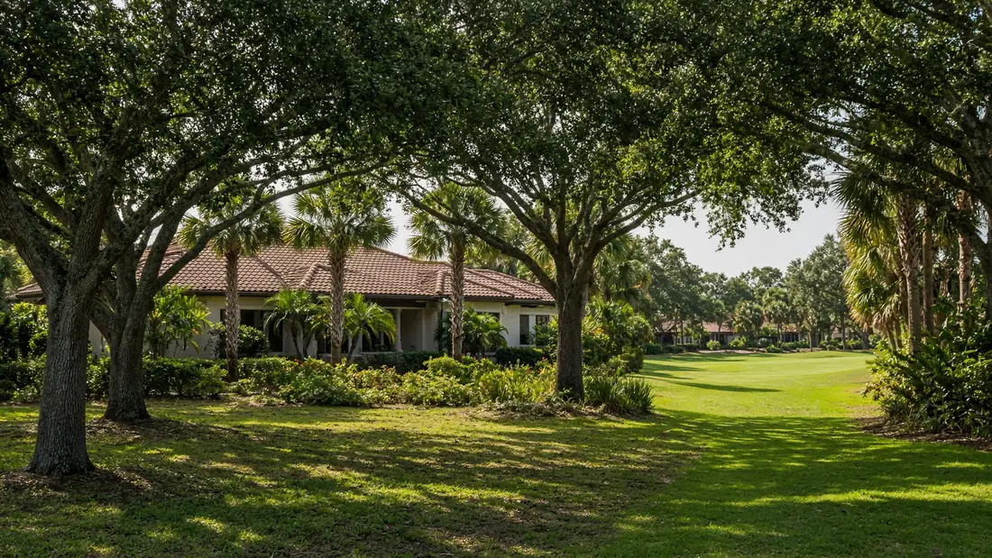 Residential street of single-story homes in Suntree, Florida